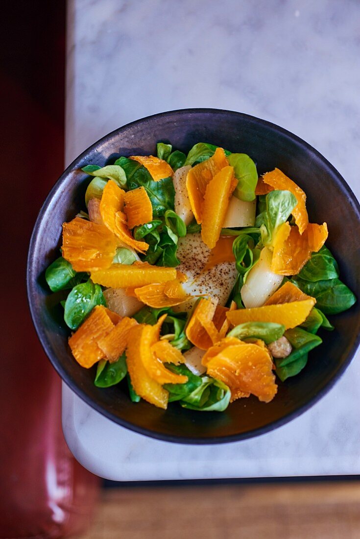 Asparagus salad with oranges, mimolette and lambs lettuce