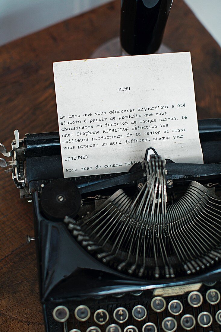 The menu of winemaker Anselme Selosse's 'Hôtel Restaurant Les Avisés' presented on an old typewriter, Avize, France