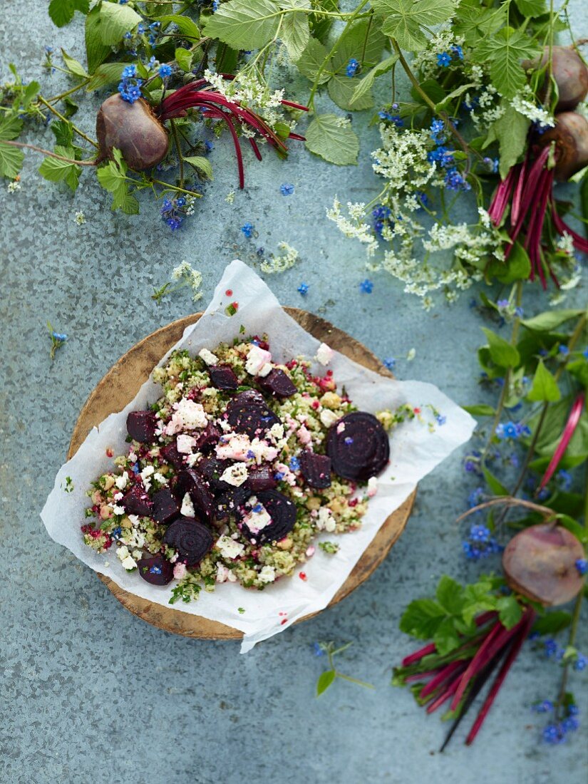 Beetroot, feta and couscous salad with fresh beetroots and pretty foliage