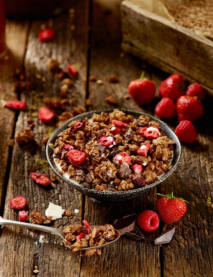 Homemade oat granola with dried strawberries, raspberries and chocolate