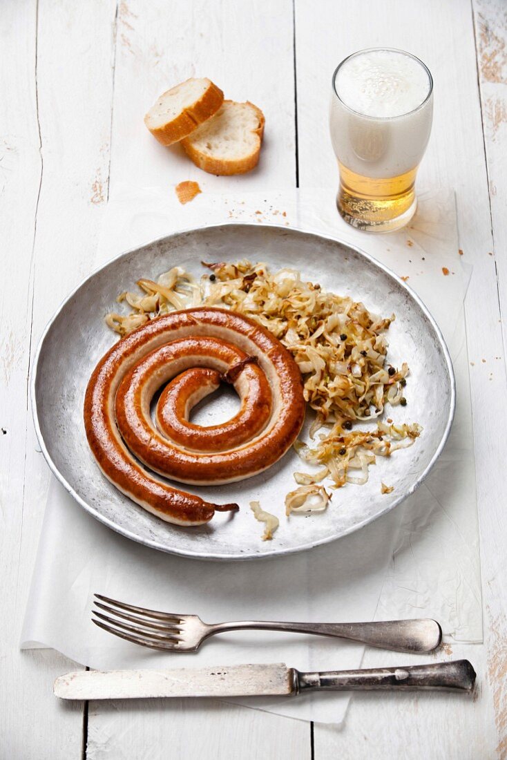 Roasted sausage with stewed cabbage and beer