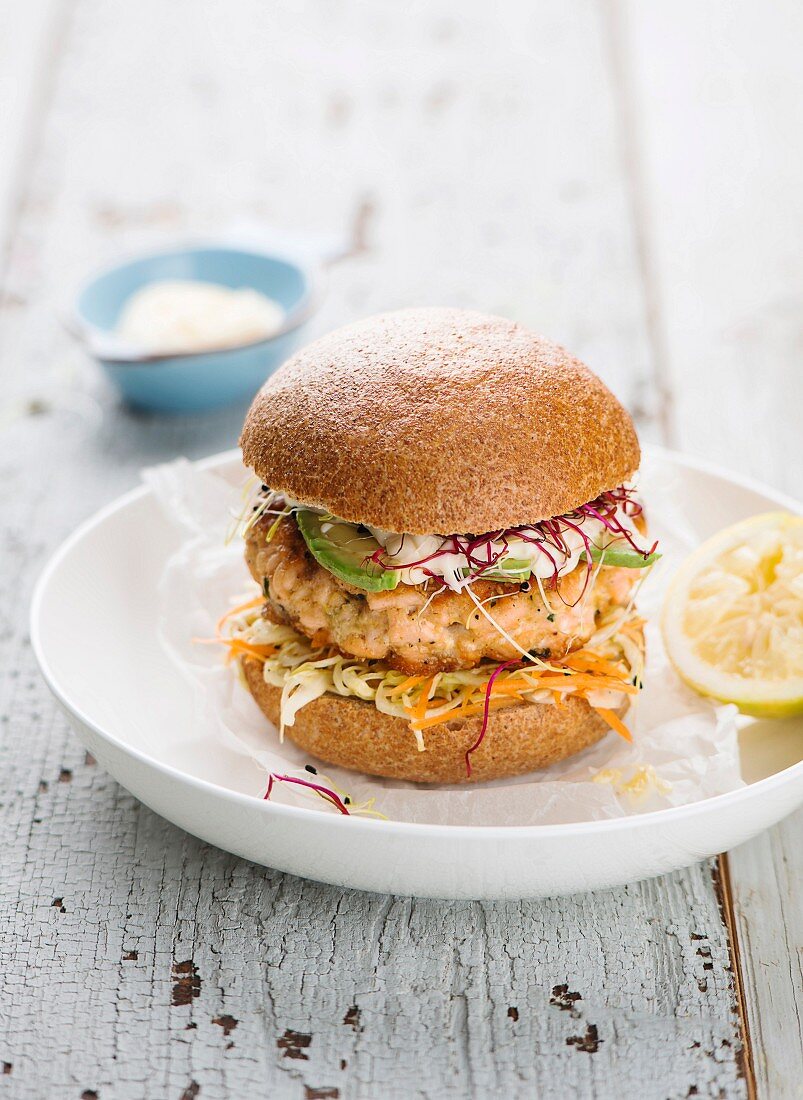 Salmon burgers with cabbage and avocado