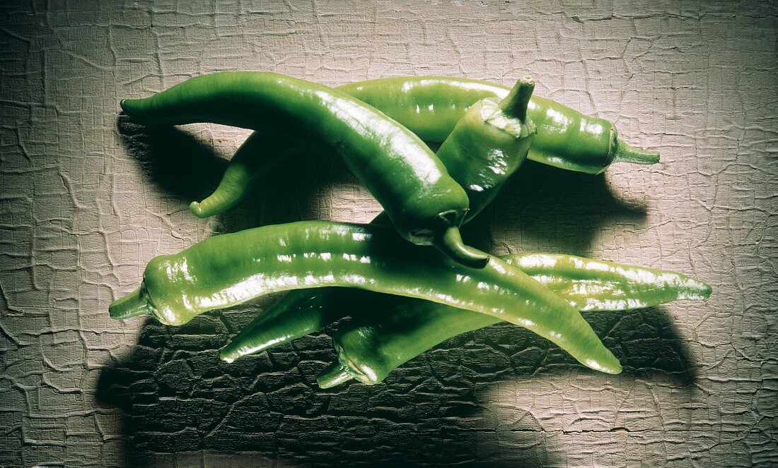 Five green chili peppers (Anaheim variety)