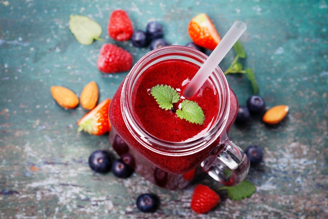 Berry smoothie on rustic background