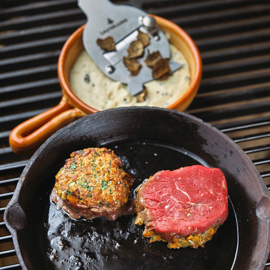 Beef steak with a cheese and herb crust and truffled polenta