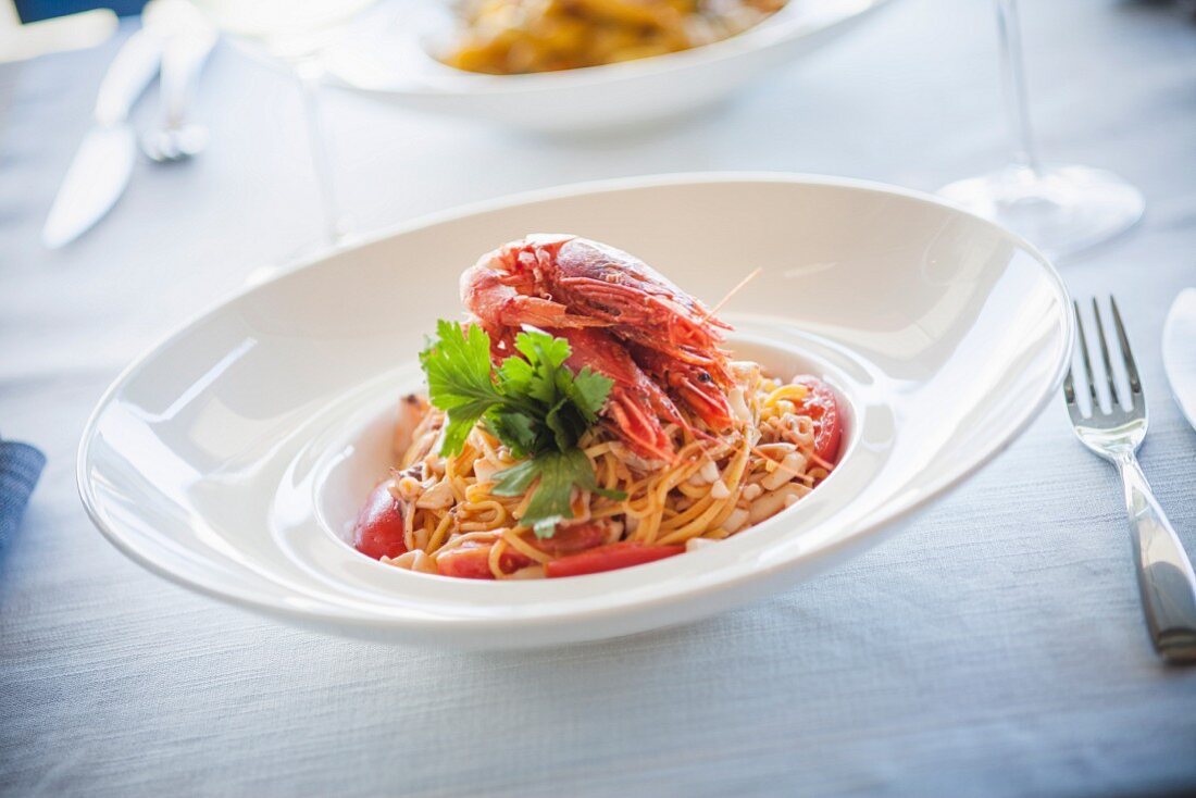 Noodles with tomato sauce and shrimp