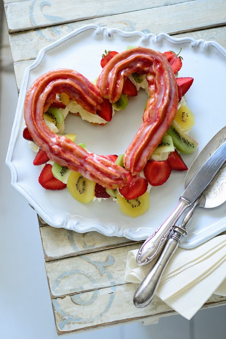A choux pastry heart with cream and fruit