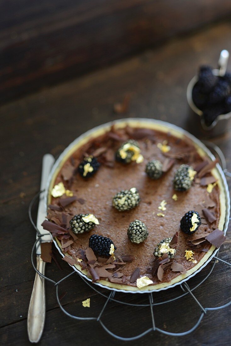 Chocolate tart topped with blackberries