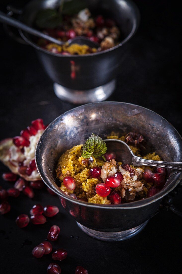 Couscous with crunchy nuts and pomegranate