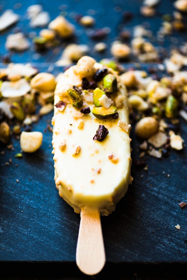 A chocolate ice lolly with dukkah (a blend of nuts and spices)