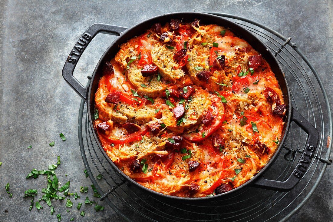 Spicy, oven-baked bread stew with tomatoes and chorizo