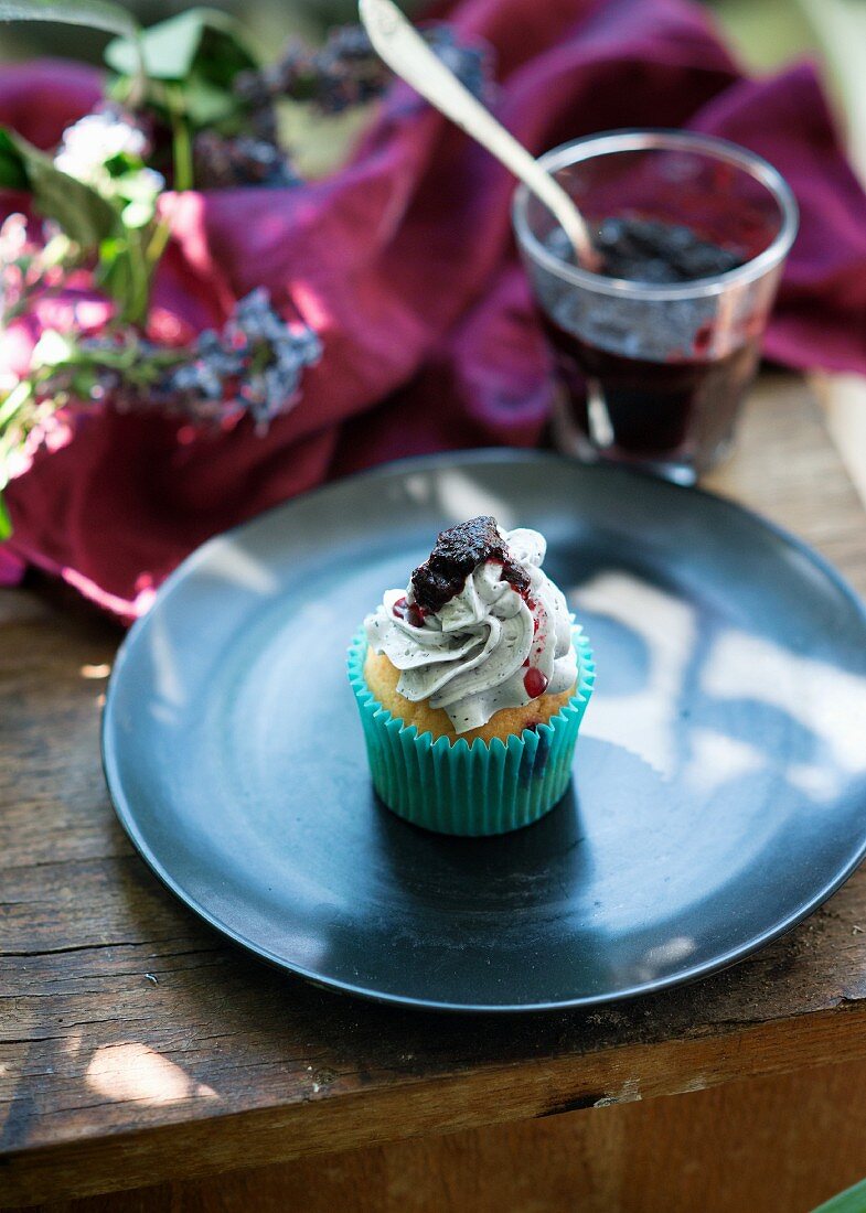 A blueberry buttercream cupcake