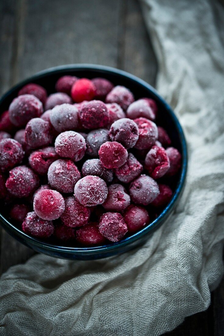 A bowl of frozen cherries