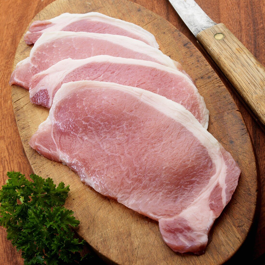 Raw English style bacon on cutting board