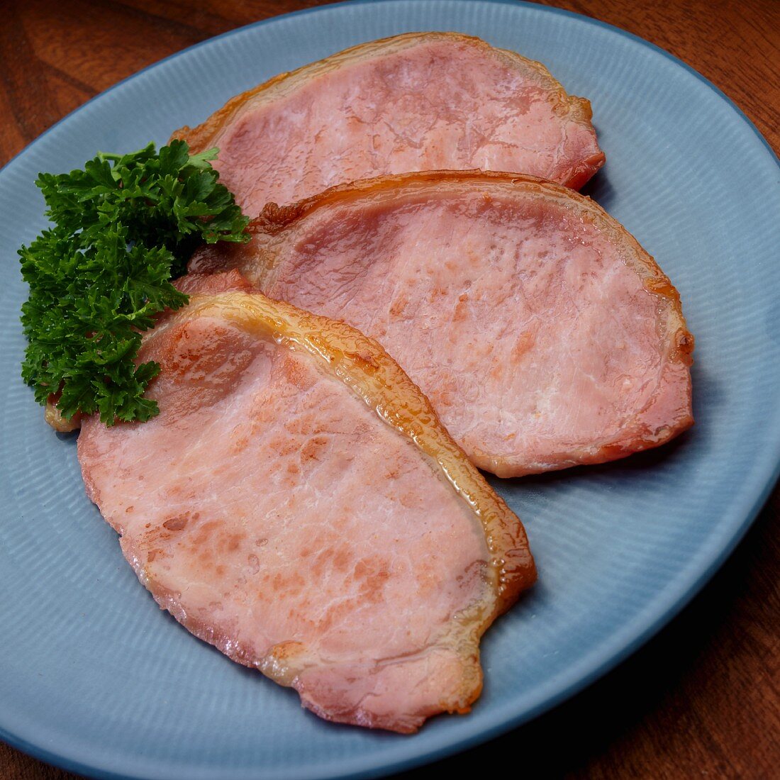 Fried English style bacon on plate