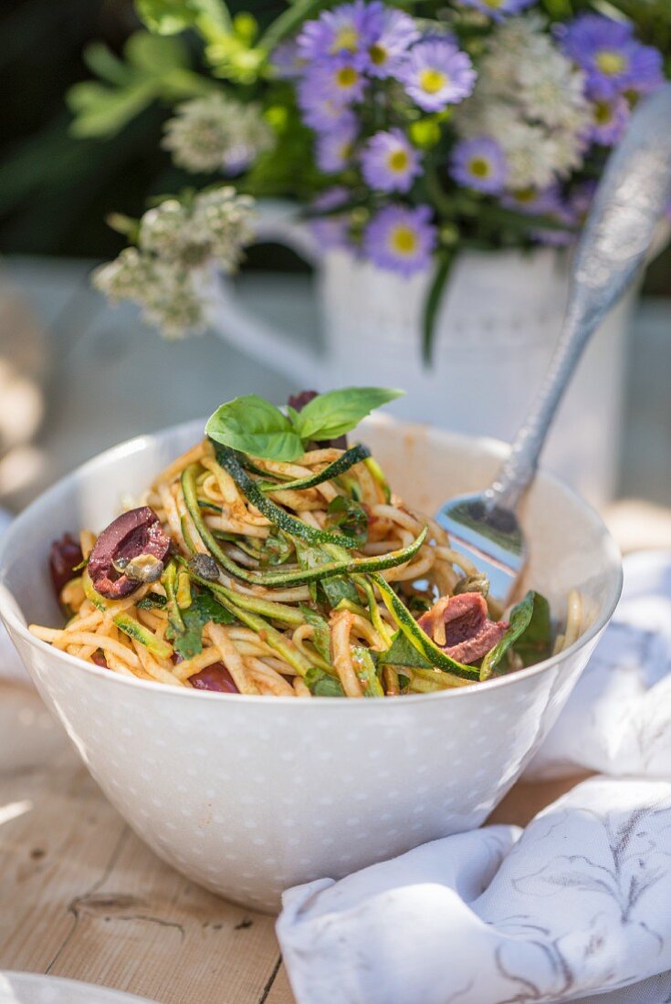 Spaghetti puttanesca with zucchini