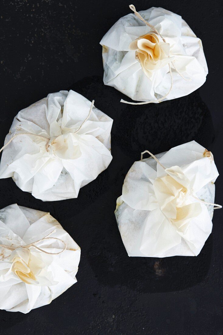 Tied parchment paper packets