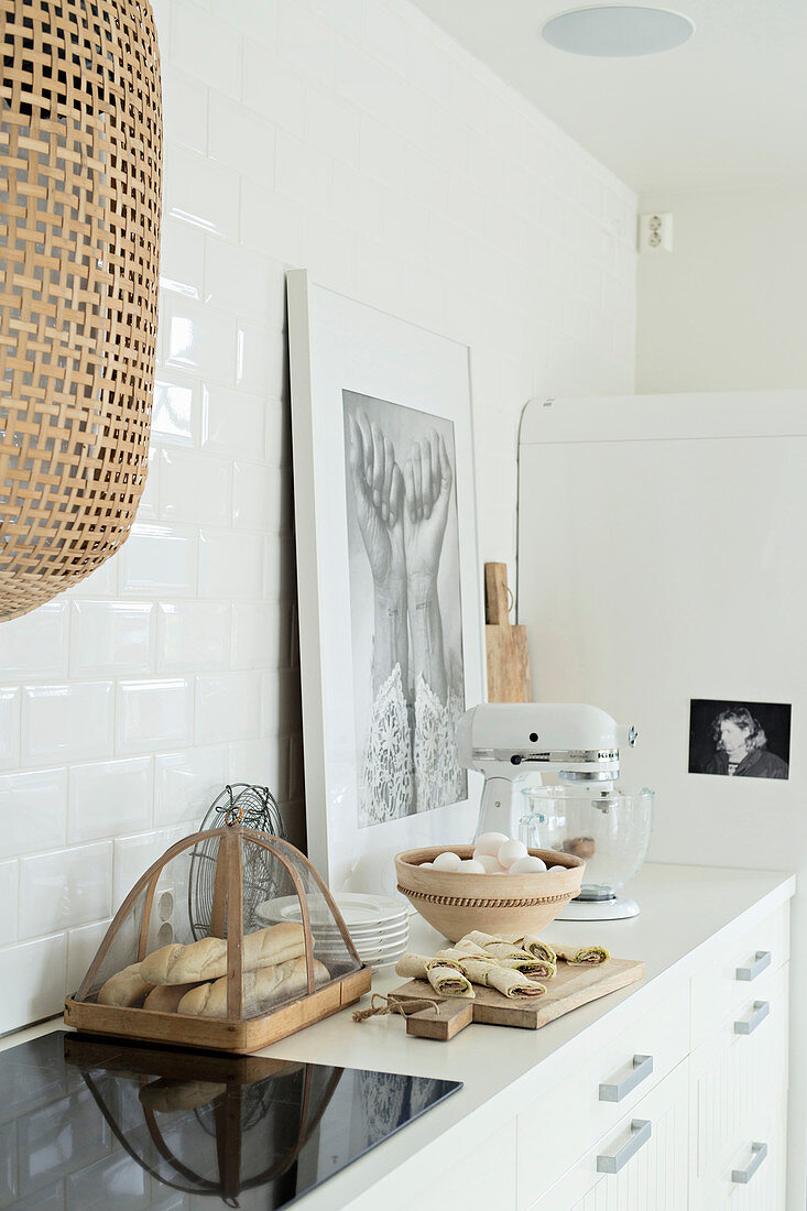 Kitchen utensils on worksurface in bright kitchen