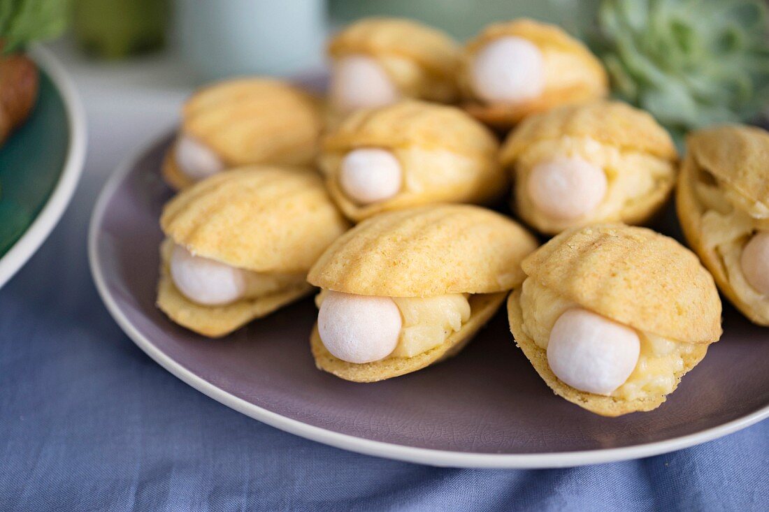 Madeleines filled with cream and a pearl for a maritime themed party