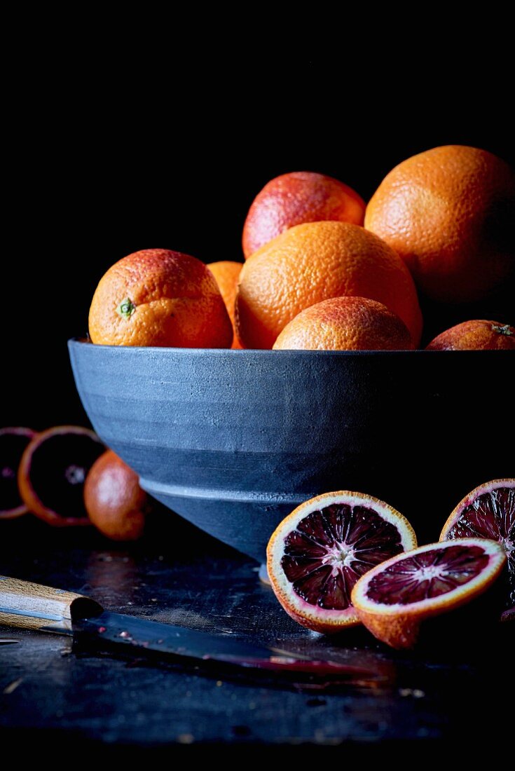 Blood oranges, whole and halved