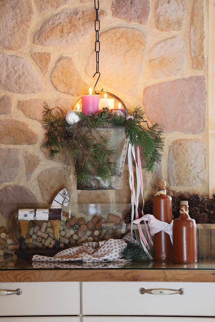 Advent arrangement with four candles in vintage metal bucket