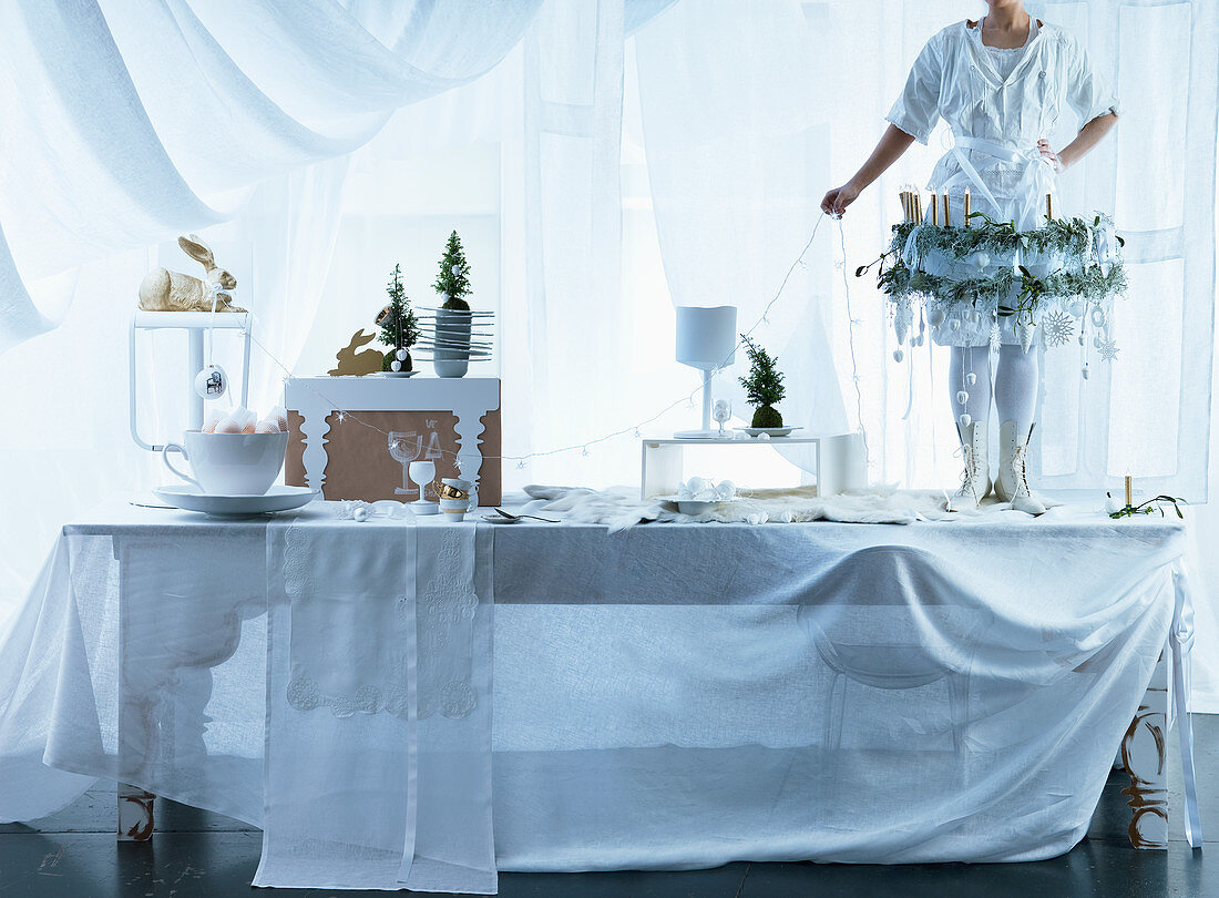 White Christmas decorations on long dining table