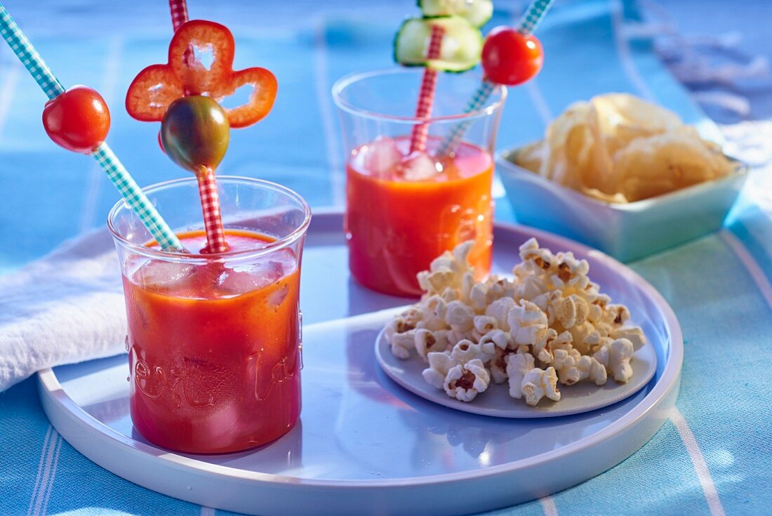 Gazpacho with peppers in glasses with straws