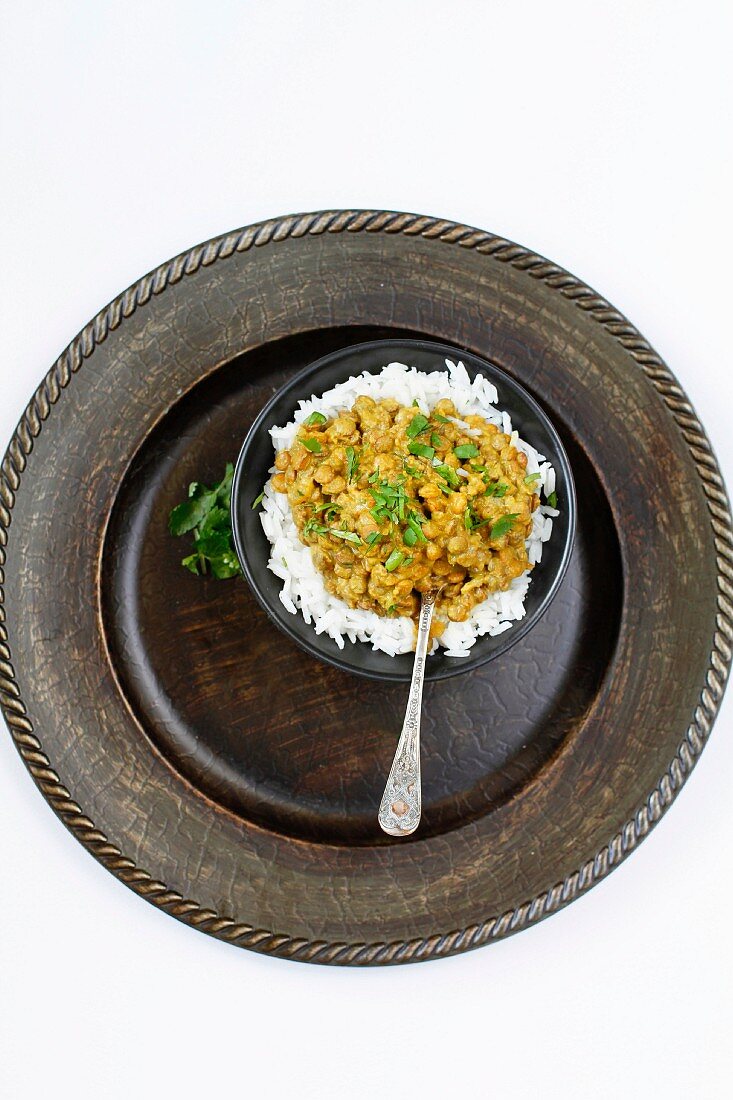 Indian Vegetarian Dhal Curry with Jasmine Rice on a Rustic plate