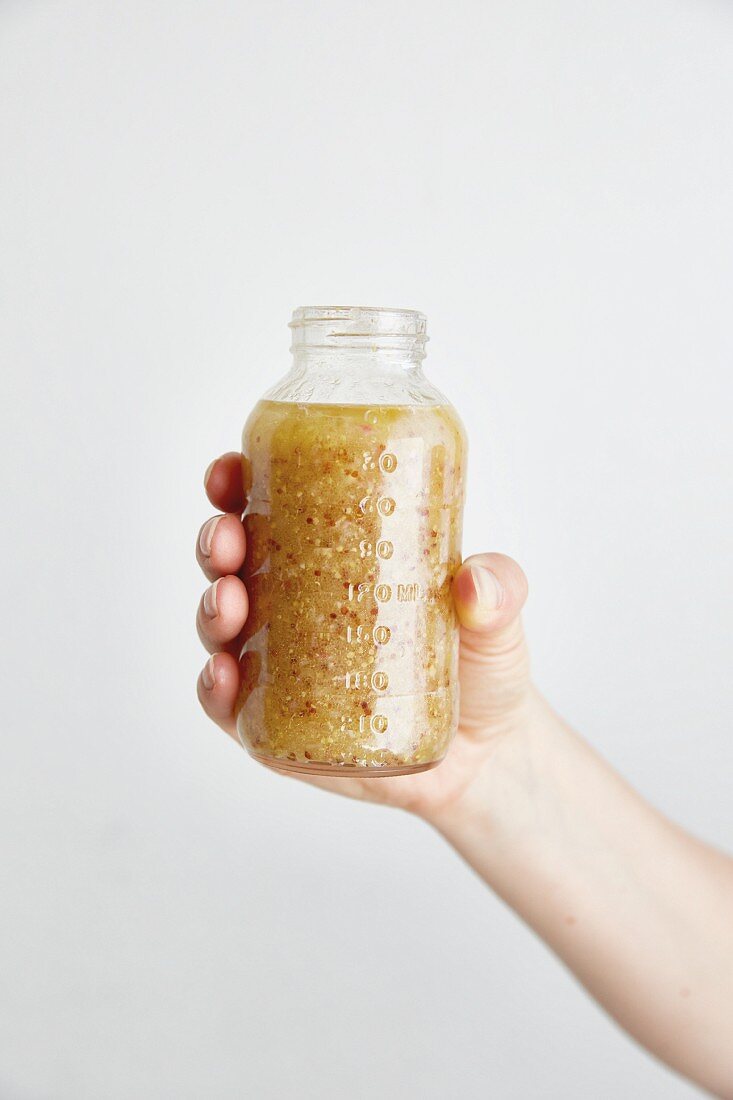 Mustard vinaigrette in a glass jar