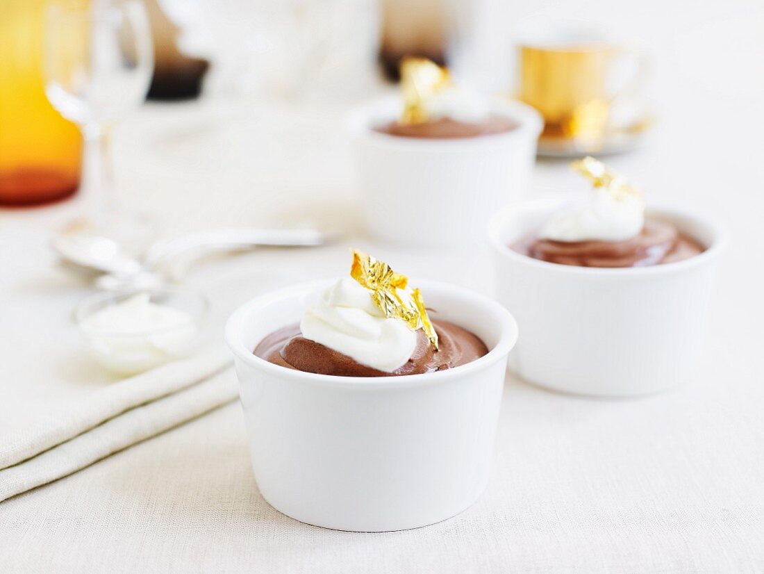 Chocolate cream pudding with sour cream and gold leaf