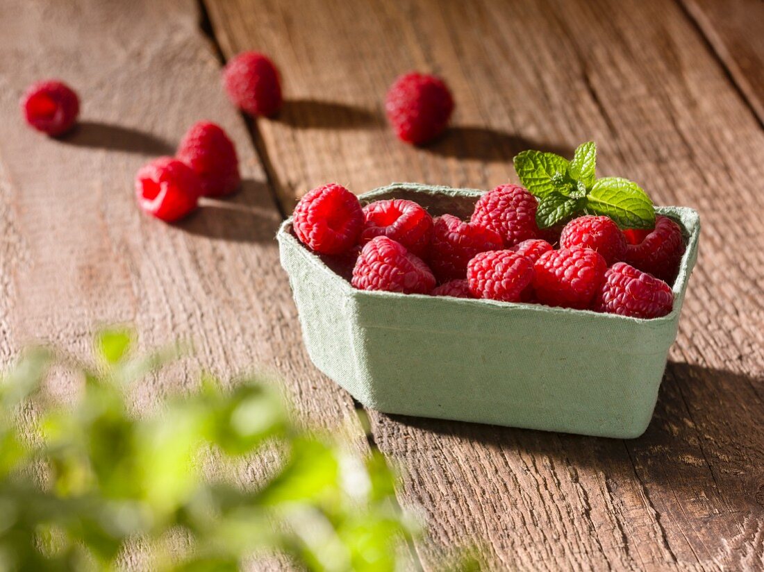 Raspberries in a paper punnet