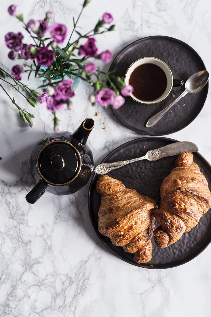 Croissants, coffee and flowers