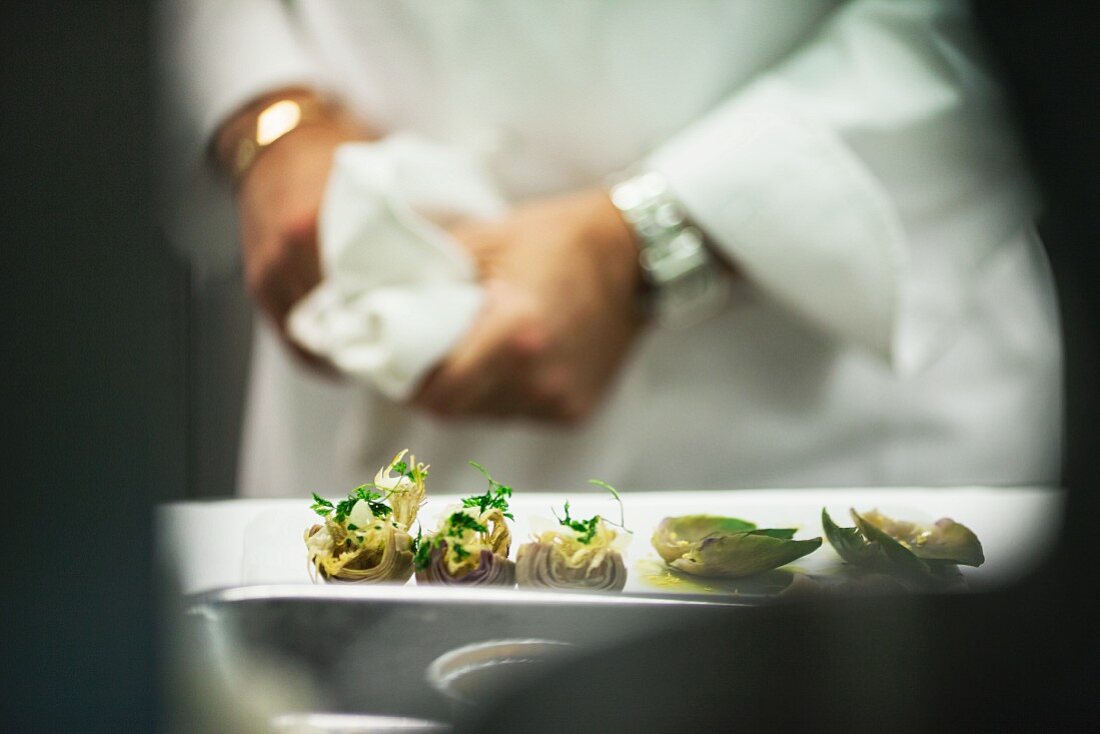 Marinated artichokes in a restaurant kitchen