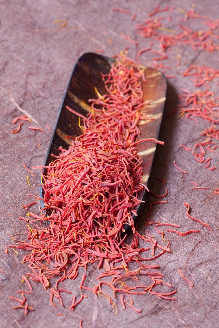 Saffron threads in a wooden bowl