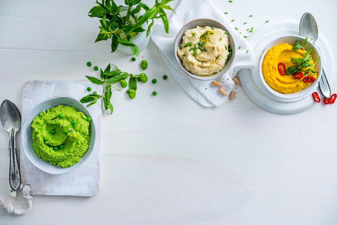 Three creamy purees with peas, parsnips and carrots