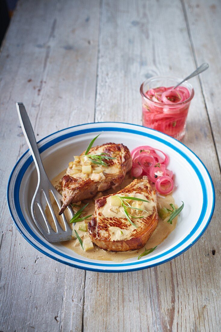 Pork chops with tarragon and pickled onions