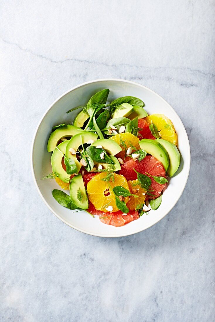 Citrus and avocado salad with baby spinach and almonds