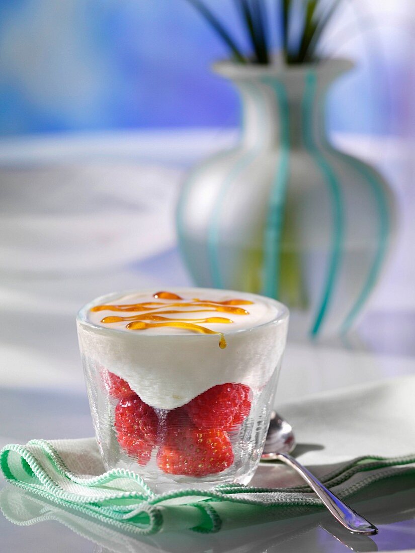A glass of berry brulee dessert