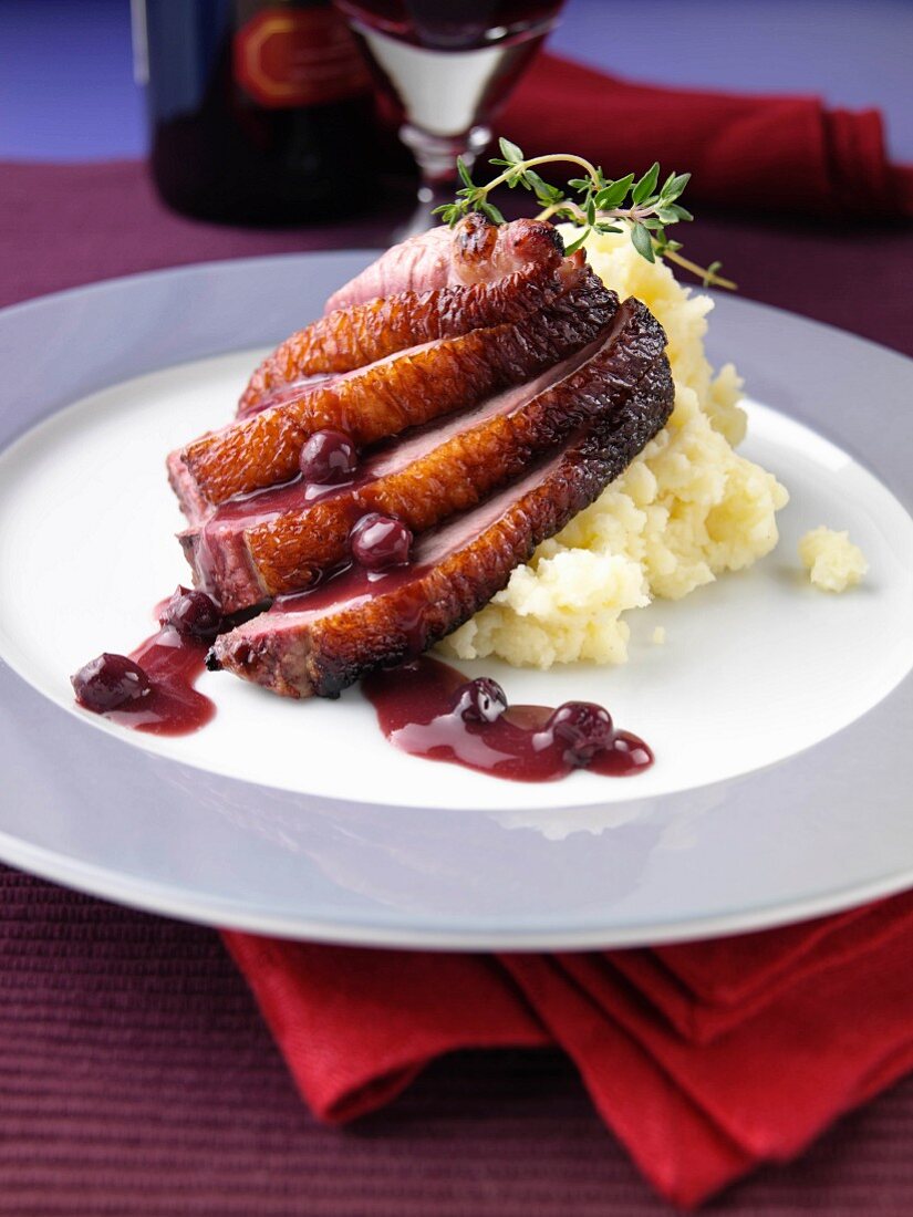 Roast duck with mashed potato and blackcurrant jus