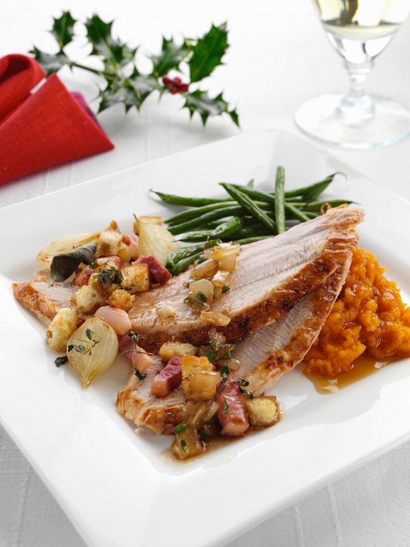 Roast turkey slices with stuffing and carrot puree