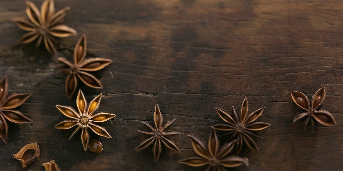 Anise stars on a wooden surface