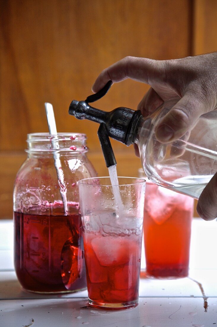 Old fashioned home made seltzer soda with raspberry syrup