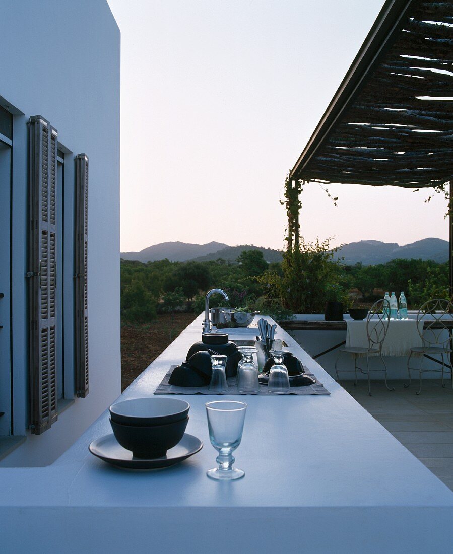 Outdoor kitchen on terrace on summer evening