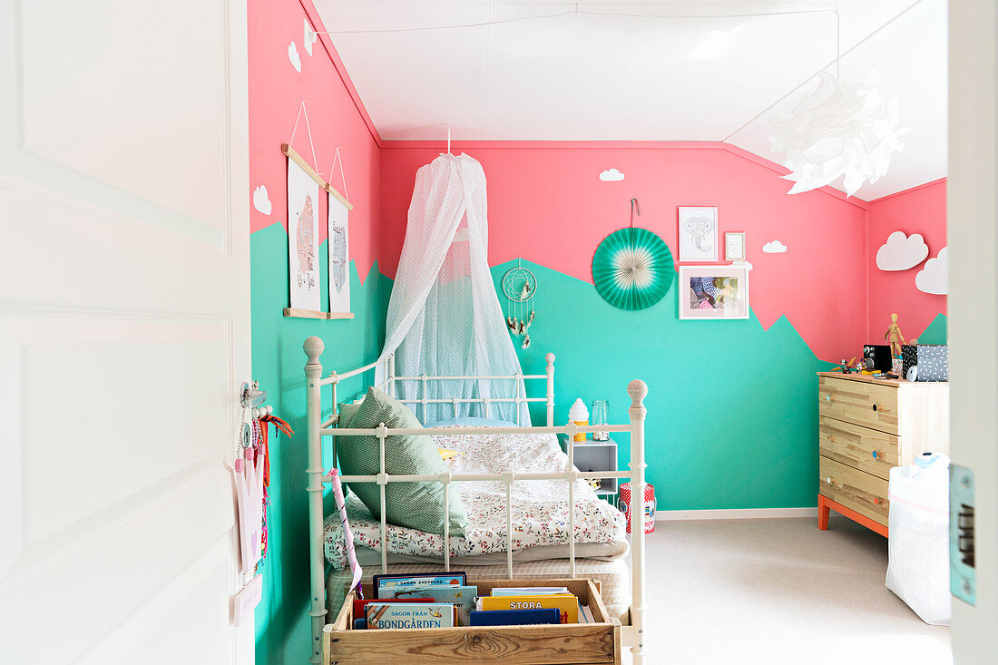 Child's bedroom with bicoloured walls in mint and pink