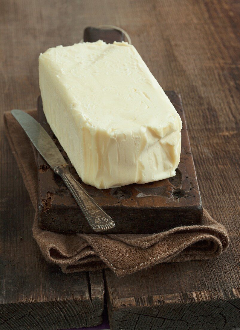 Butter on chopping board with knife