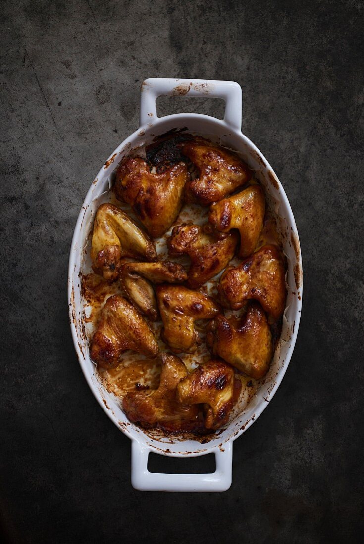 Roast chicken wings in a roasting tin