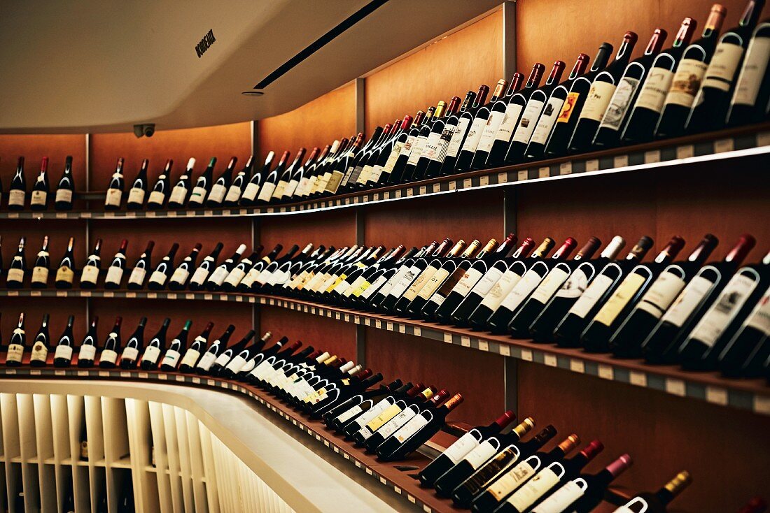 Shelves of wine at 'Vintry Fine Wines' on the northern edge of Battery Park, Downtown Manhattan, New York, USA