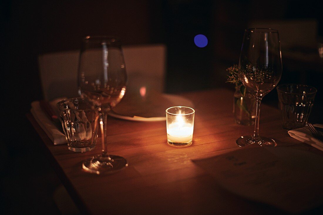 A candlelit table in the 'The Four Horsemen' wine bar in Williamsburg, Brooklyn, New York, USA