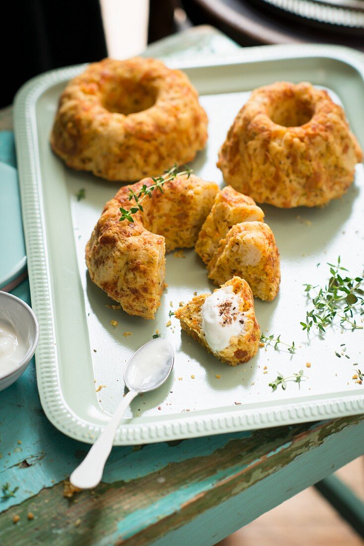 Savoury ring cakes with yoghurt and thyme on a tray