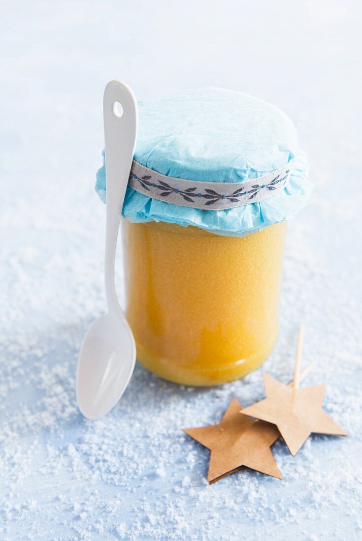 Lemon curd in a glass jar as a gift